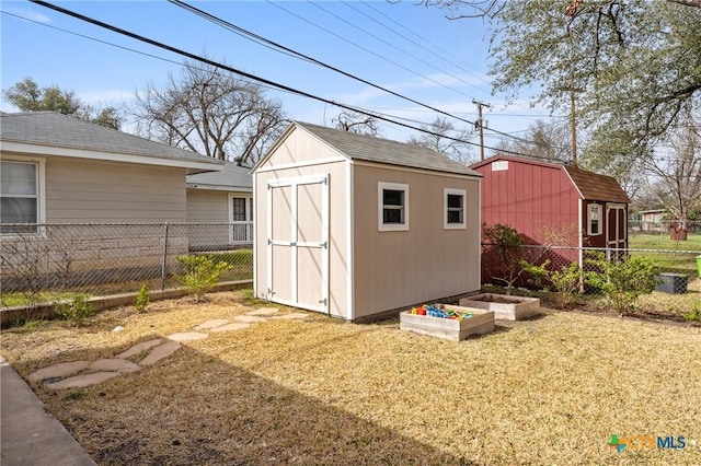 view of shed featuring a garden and fence