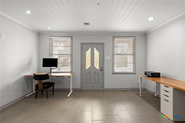 foyer featuring baseboards, visible vents, and crown molding