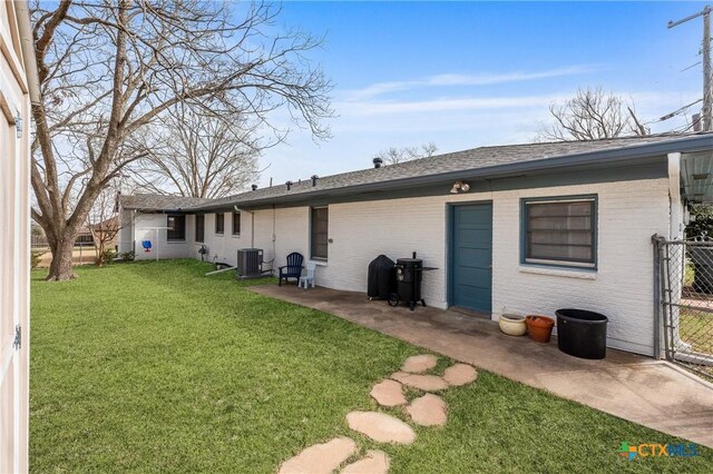 ranch-style home with a front lawn, driveway, and an attached garage