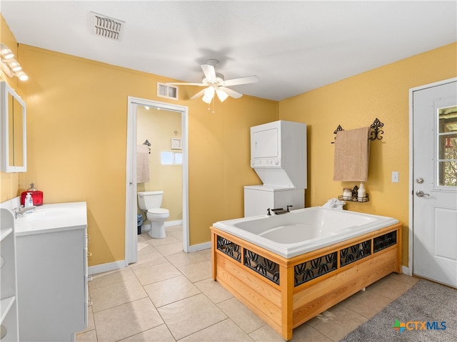 4386 Morningside Way, Canyon Lake, TX 78133 - full bath featuring estacked washer and dryer, a ceiling fan, vanity, and tile patterned flooring
