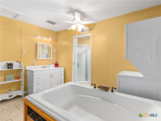 4386 Morningside Way, Canyon Lake, TX 78133 - bathroom with a bath, vanity, a shower stall, a ceiling fan, and tile patterned flooring