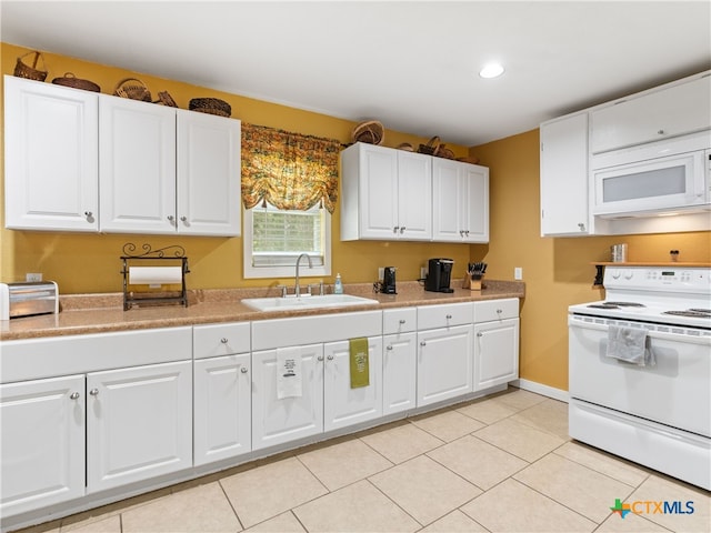 4386 Morningside Way, Canyon Lake, TX 78133 - kitchen featuring white appliances, white cabinets, light countertops, light tile patterned flooring, and recessed lighting
