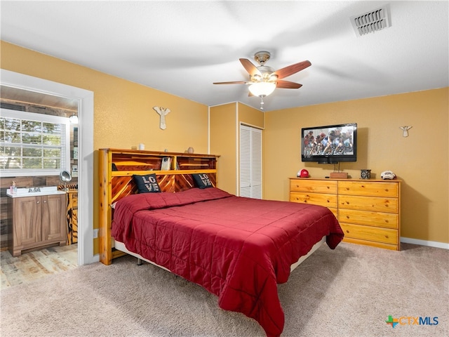 4386 Morningside Way, Canyon Lake, TX 78133 - bedroom featuring light carpet, a ceiling fan, and a closet