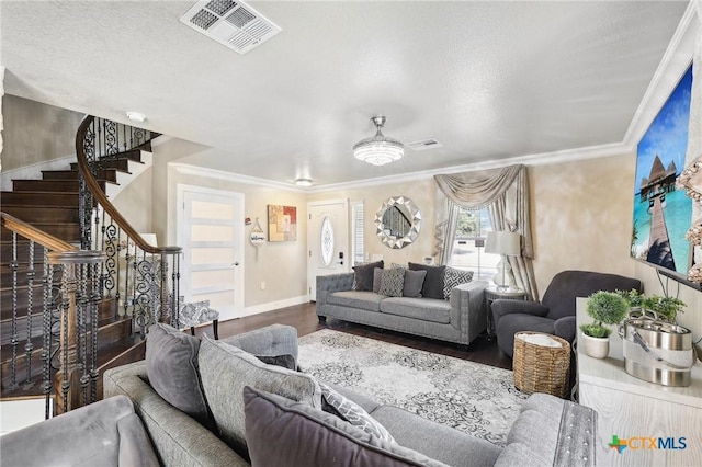 living room featuring hardwood / wood-style floors and crown molding