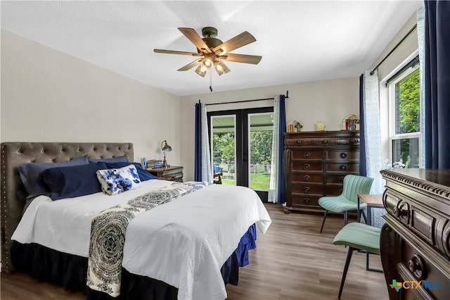 326 Riverview Rd, Mcqueeney, TX 78123 - bedroom with french doors, access to exterior, wood finished floors, and ceiling fan