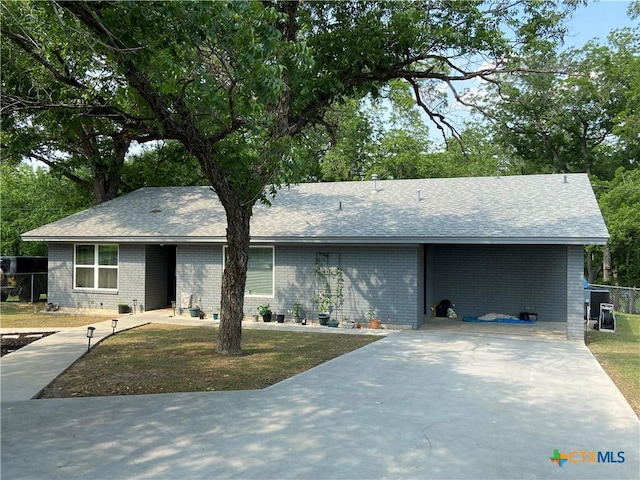 326 Riverview Rd, Mcqueeney, TX 78123 - ranch-style home with brick siding, driveway, and a shingled roof