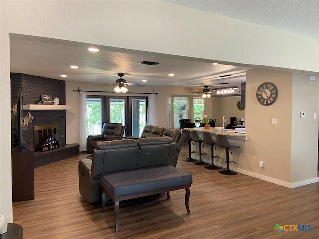 326 Riverview Rd, Mcqueeney, TX 78123 - living room with ceiling fan, wood finished floors, baseboards, a textured ceiling, and recessed lighting