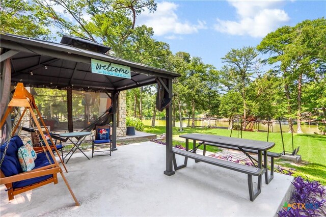 326 Riverview Rd, Mcqueeney, TX 78123 - view of home's community with a gazebo, a patio, and view of scattered trees