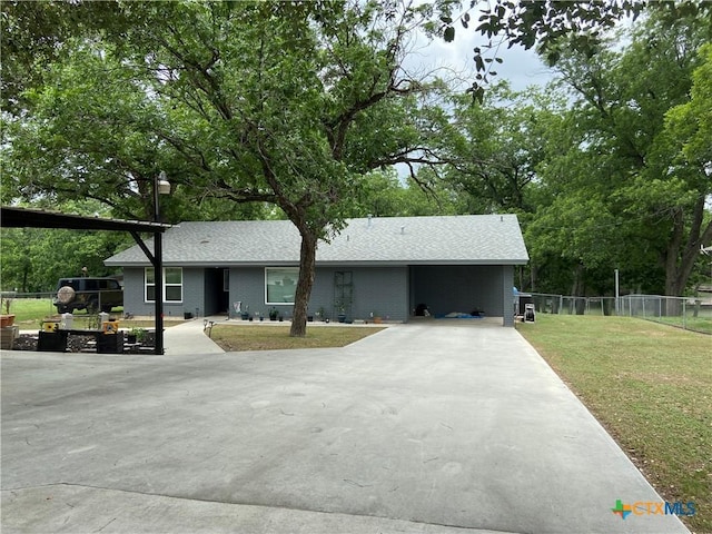 326 Riverview Rd, Mcqueeney, TX 78123 - view of front facade featuring driveway, a shingled roof, and brick siding