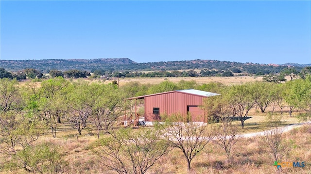 property view of mountains featuring a rural view