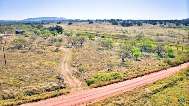 aerial view with a mountain view and a rural view