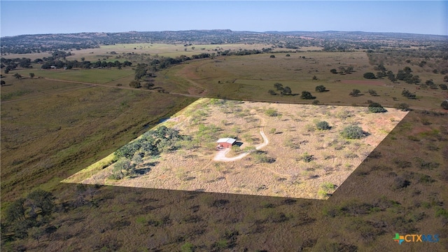 birds eye view of property featuring a rural view