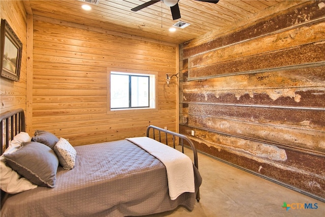 bedroom featuring wood walls, wood ceiling, and ceiling fan