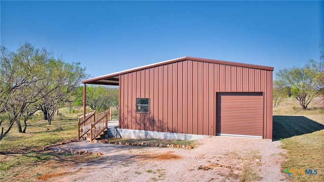 view of outbuilding with a garage