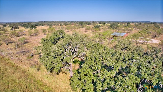 birds eye view of property featuring a rural view