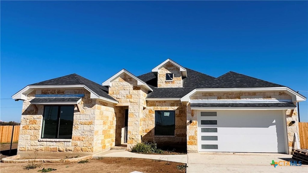 view of front of property with a garage