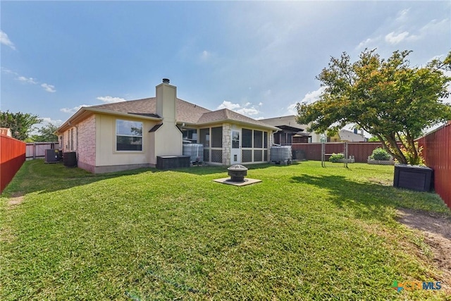 237 Scarlet Ln, Harker Heights, TX 76548 - rear view of property with central air condition unit, a chimney, and a sunroom