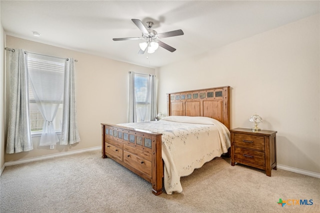 bedroom featuring ceiling fan and light colored carpet