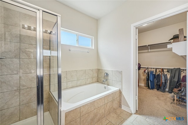 bathroom with tile patterned flooring and plus walk in shower