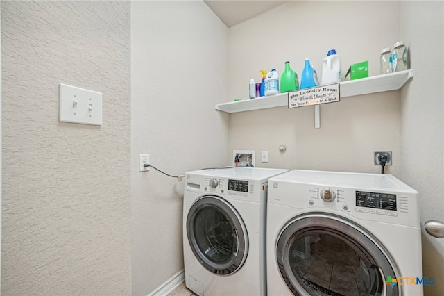 clothes washing area featuring washer and dryer