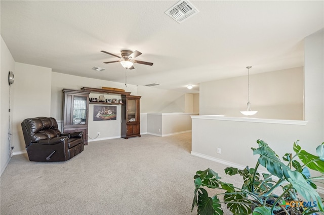 sitting room featuring ceiling fan and light carpet