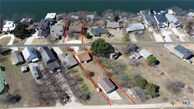 birds eye view of property with a residential view