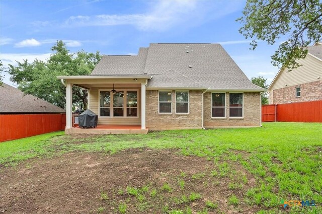 2005 Red Fox Dr, Nolanville, TX 76559 - back of house with a ceiling fan, a shingled roof, a patio, and brick siding