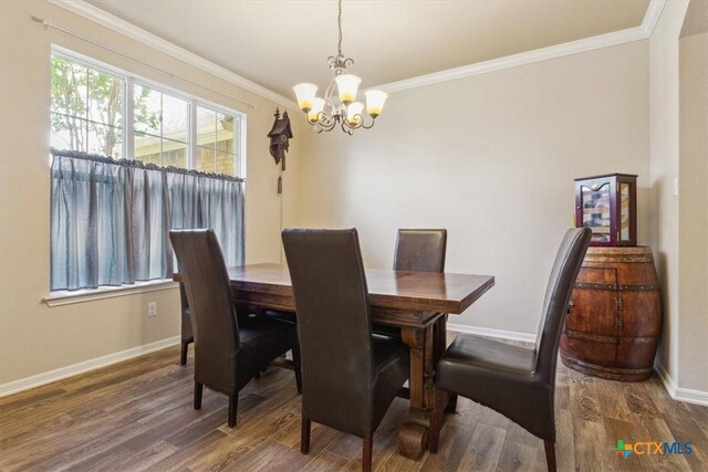 2005 Red Fox Dr, Nolanville, TX 76559 - dining room featuring a chandelier, wood finished floors, baseboards, and ornamental molding