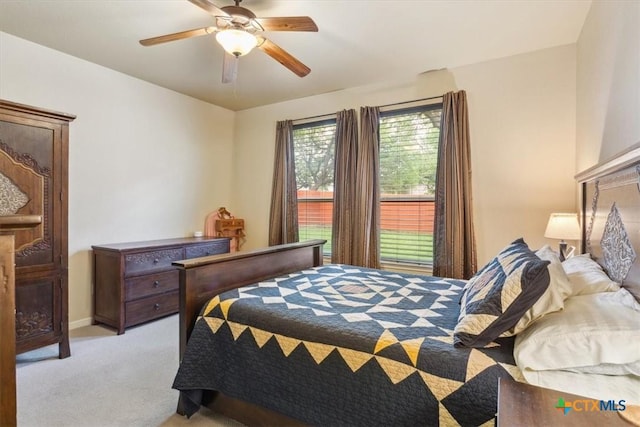 2005 Red Fox Dr, Nolanville, TX 76559 - bedroom with light colored carpet and a ceiling fan