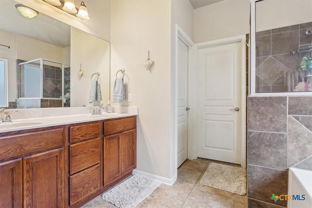 2005 Red Fox Dr, Nolanville, TX 76559 - full bathroom with tiled shower, tile patterned flooring, double vanity, and a tub