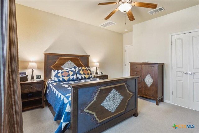 2005 Red Fox Dr, Nolanville, TX 76559 - bedroom with light colored carpet, a closet, and a ceiling fan