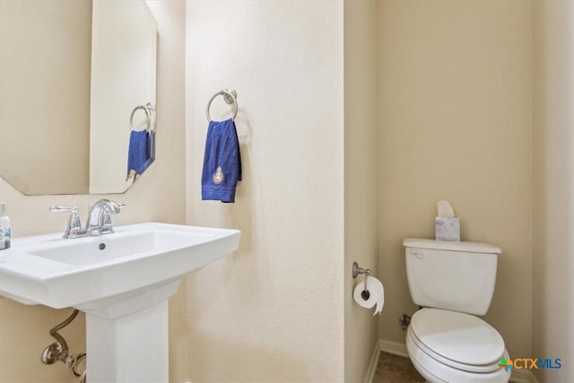 2005 Red Fox Dr, Nolanville, TX 76559 - half bath featuring toilet and baseboards