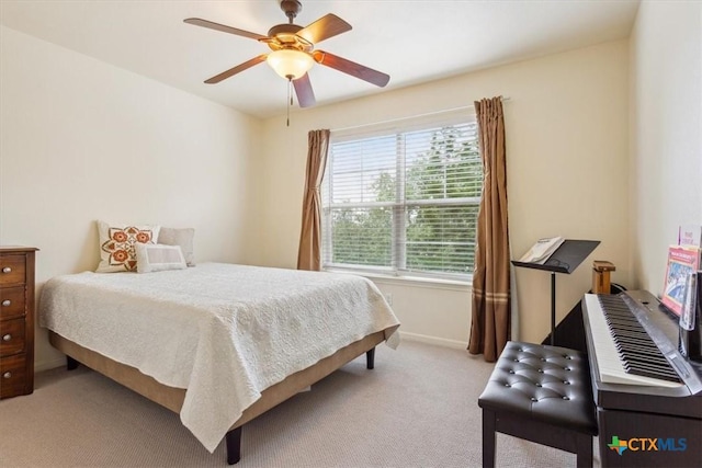 2005 Red Fox Dr, Nolanville, TX 76559 - bedroom with light colored carpet, baseboards, and a ceiling fan