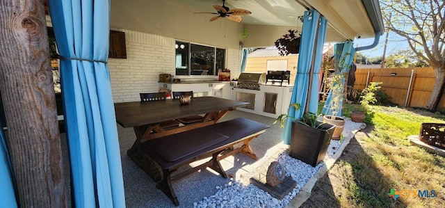 view of patio / terrace featuring area for grilling and ceiling fan