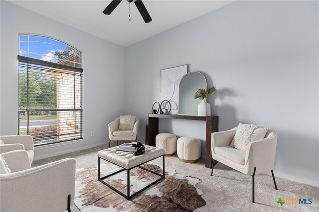 2129 Aaron Ross Way, Round Rock, TX 78665 - sitting room with baseboards, a ceiling fan, and carpet floors