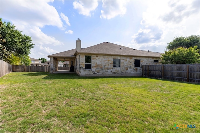 2129 Aaron Ross Way, Round Rock, TX 78665 - back of house featuring a chimney, a patio area, a shingled roof, a lawn, and a fenced backyard