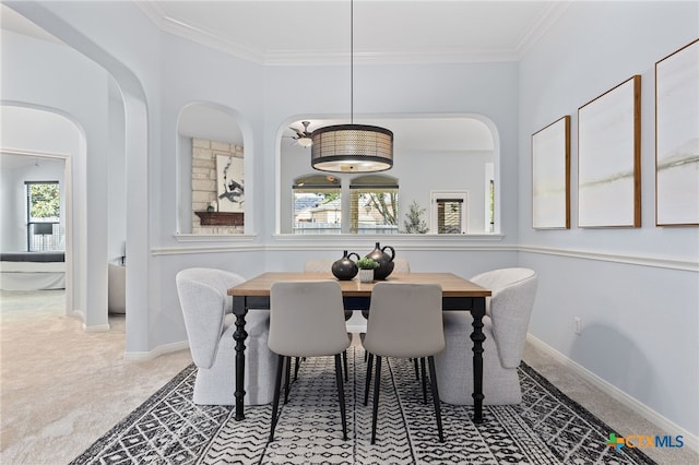 2129 Aaron Ross Way, Round Rock, TX 78665 - dining room with crown molding, carpet, and baseboards