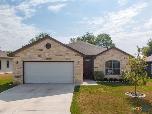 ranch-style house with a garage and a front yard