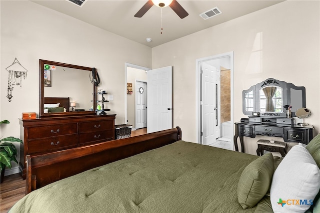 bedroom featuring ceiling fan, ensuite bathroom, and wood-type flooring