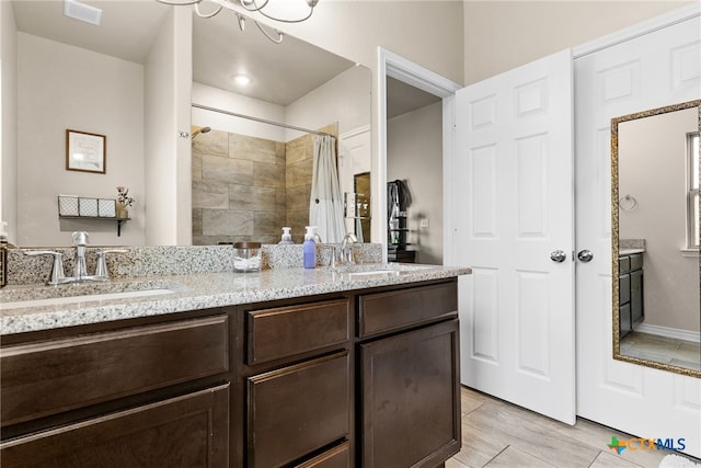 bathroom with a shower with curtain, wood-type flooring, and vanity