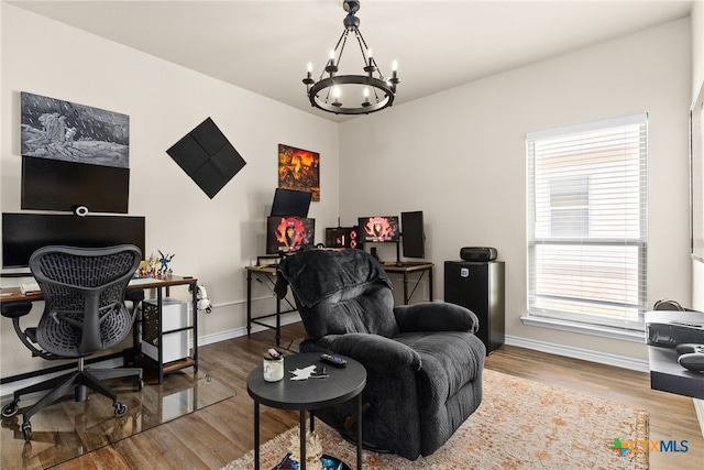 office featuring a chandelier and wood-type flooring