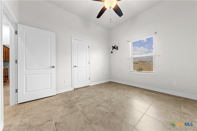 unfurnished bedroom featuring ceiling fan and light tile patterned flooring