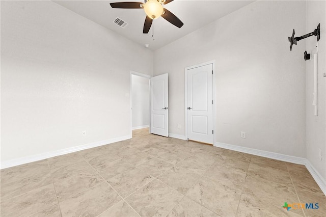 interior space with ceiling fan