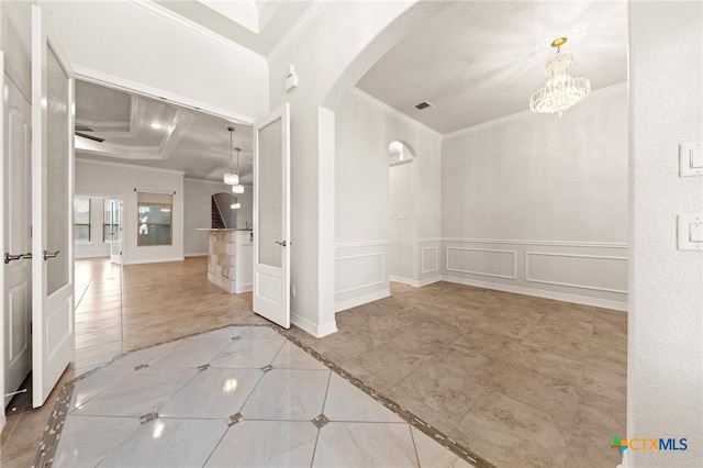 interior space with an inviting chandelier and crown molding