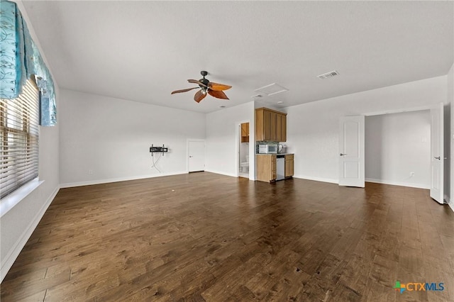 unfurnished living room with ceiling fan and dark wood-type flooring