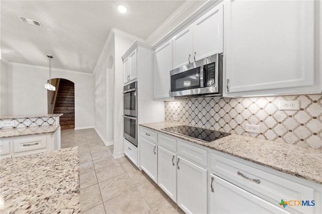 kitchen featuring ornamental molding, tasteful backsplash, decorative light fixtures, white cabinetry, and stainless steel appliances