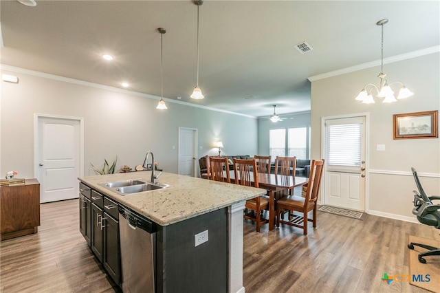 7106 Boulder Star Way, Temple, TX 76502 - kitchen featuring a sink, ornamental molding, stainless steel dishwasher, wood finished floors, and decorative light fixtures
