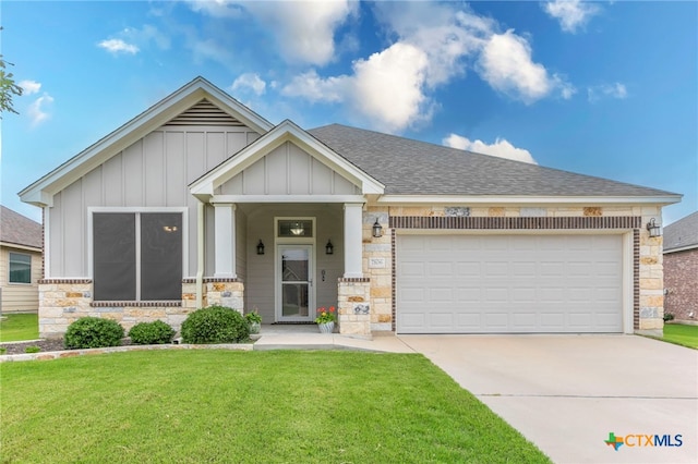 7106 Boulder Star Way, Temple, TX 76502 - view of front of property with board and batten siding, a front lawn, stone siding, driveway, and an attached garage