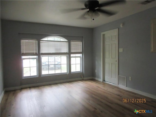 1109 E E Avenue M, Belton, TX 76513 - unfurnished room featuring a ceiling fan and wood finished floors