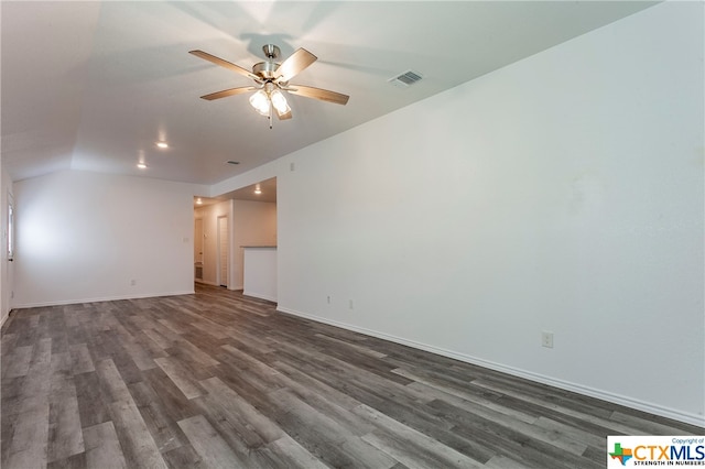 spare room featuring dark wood-type flooring, ceiling fan, and lofted ceiling